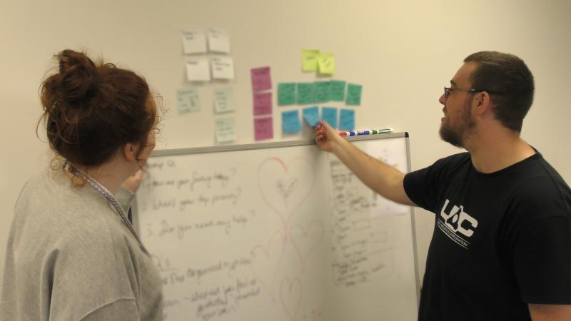 A stand-up with two of the wider team